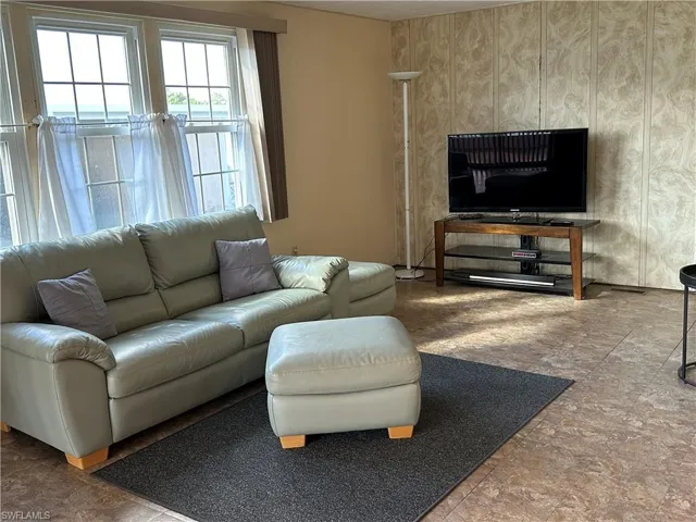 Living room with stone finish flooring