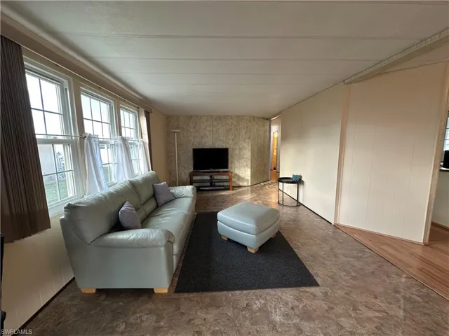 Living area featuring a decorative wall