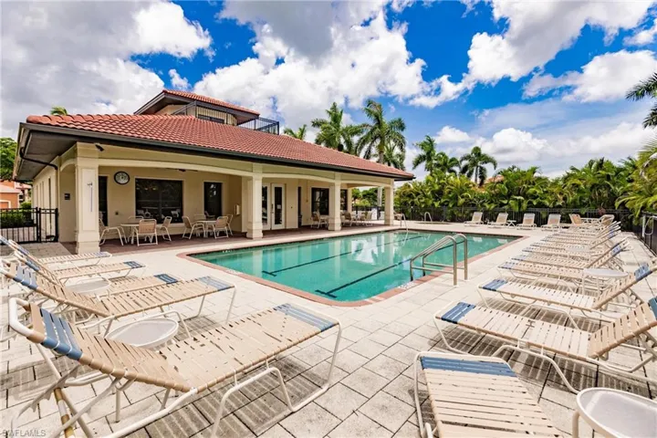 View of Clubhouse, community swimming pool featuring a patio area