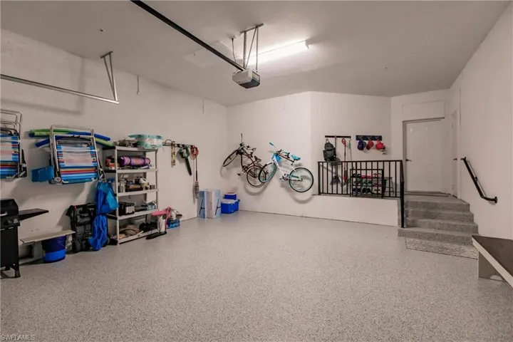Garage featuring a garage door opener