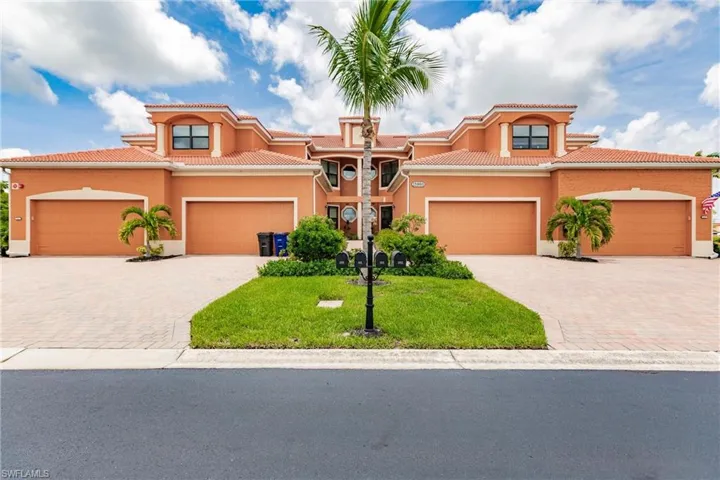 Mediterranean / spanish house featuring a garage