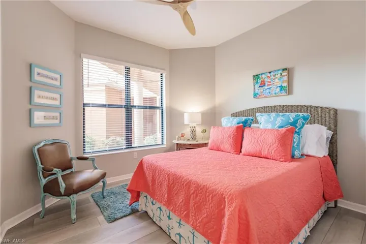 Bedroom featuring ceiling fan and light hardwood / wood-style flooring