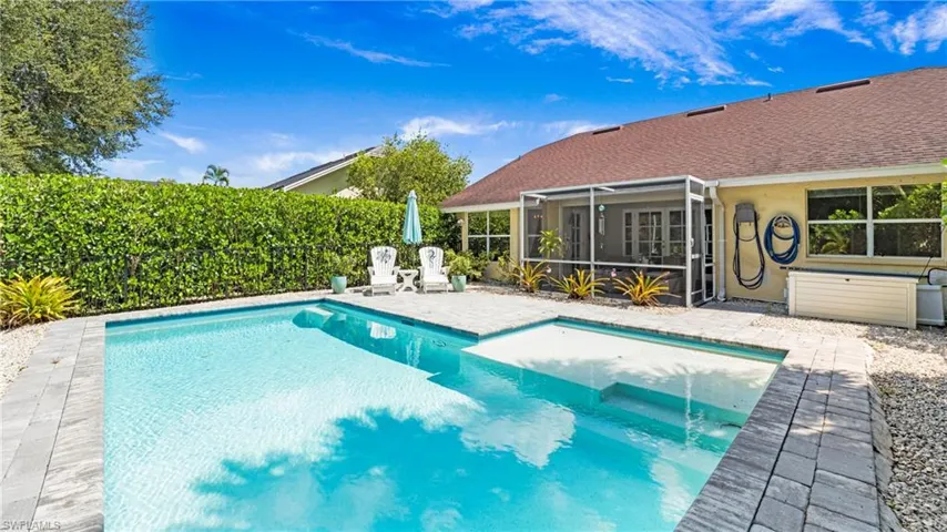View of pool featuring a sunroom and a patio area