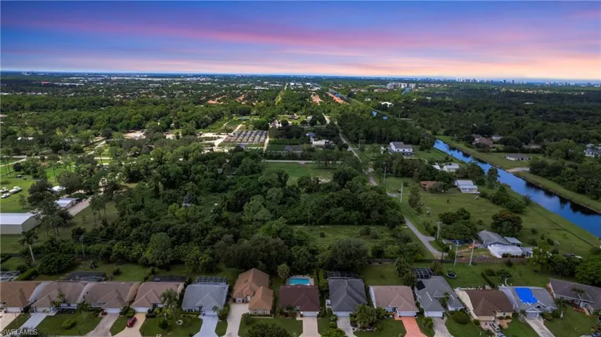 View of property location featuring nearby suburban area and a nearby body of water