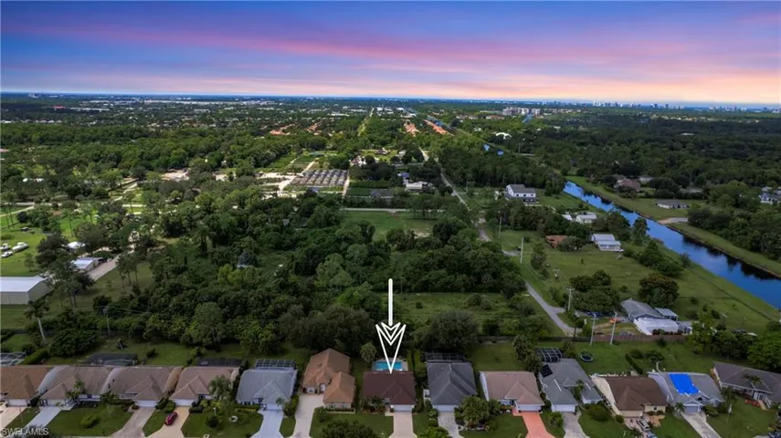 View of property location featuring nearby suburban area and a large body of water