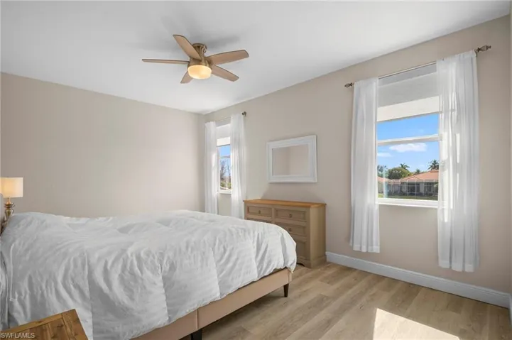 Bedroom featuring wood finished floors and a ceiling fan