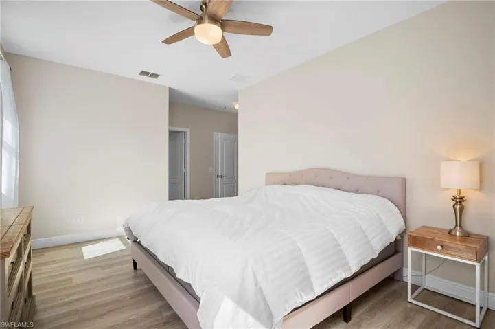 Bedroom featuring light wood-type flooring and ceiling fan