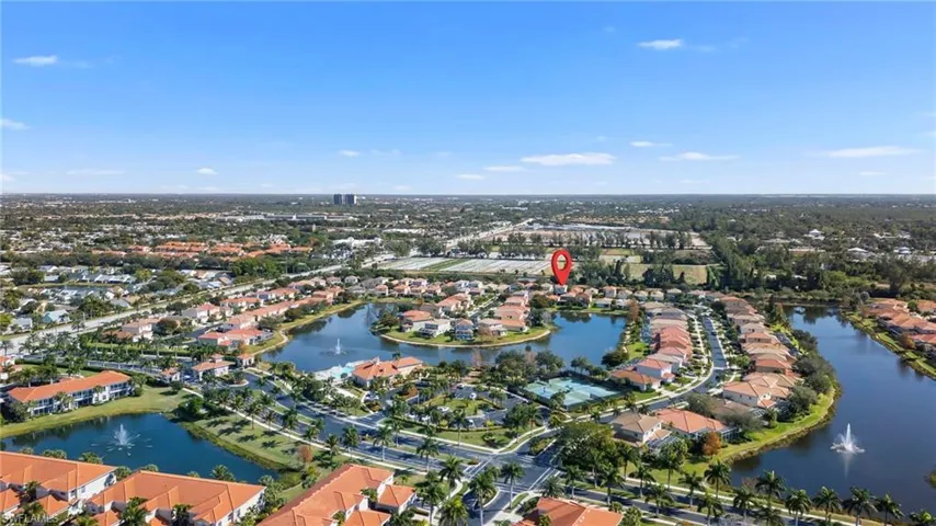 Aerial overview of property's location with nearby suburban area and a large body of water