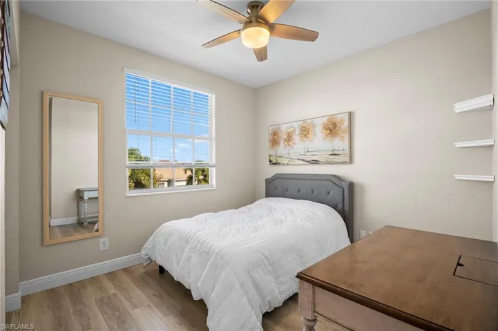 Bedroom with light wood-type flooring and ceiling fan