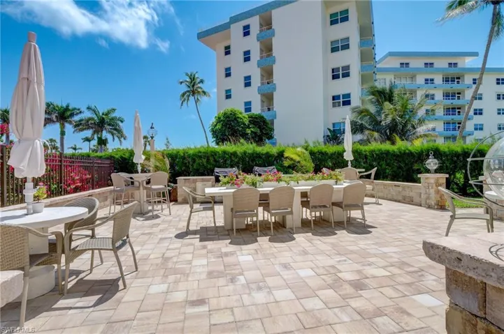 View of patio with a balcony