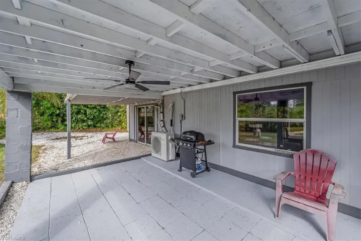 View of patio featuring a grill, washer / clothes dryer, and ceiling fan