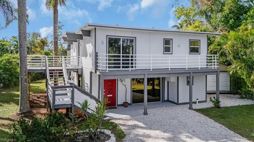 Rear view of house featuring a deck