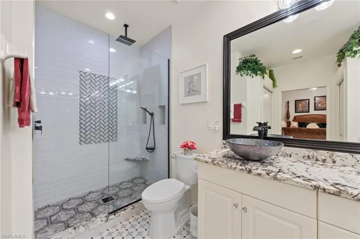 NEWLY UPDATED PRIMARY BATH WITH WALK-IN SHOWER AND SEAMLESS GLASS