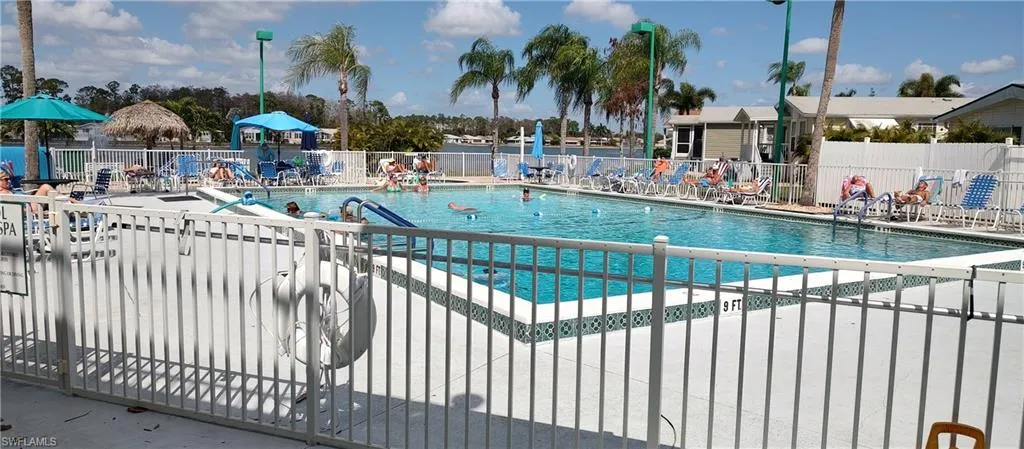 Community pool featuring a patio