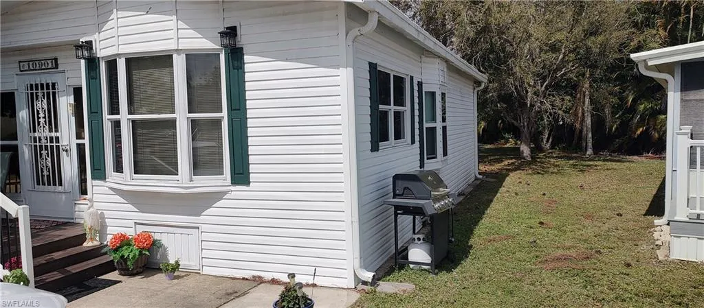 View of home's exterior featuring a lawn