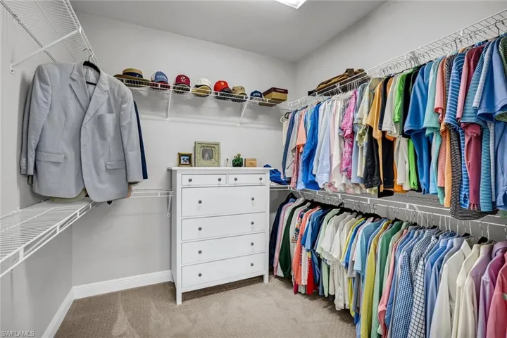 Spacious closet featuring carpet flooring
