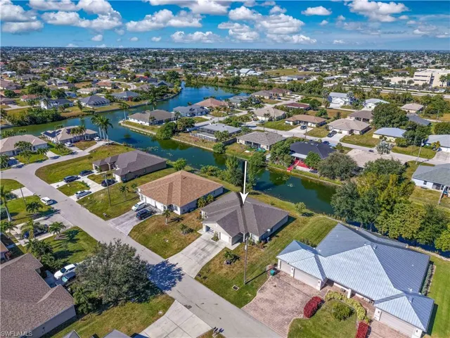 Aerial view of residential area featuring a large body of water