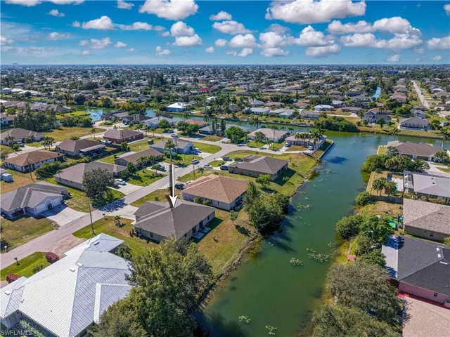 Aerial view of residential area with a nearby body of water