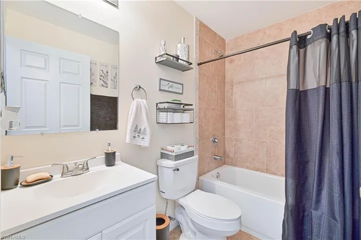 Guest Bathroom with shower / tub combo and vanity