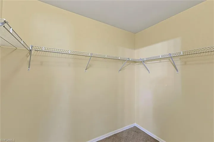 Corner closet featuring wire shelving