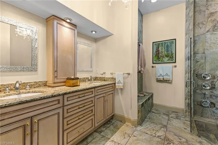 Main Bathroom with walk in shower, tile flooring, double sink, and oversized vanity