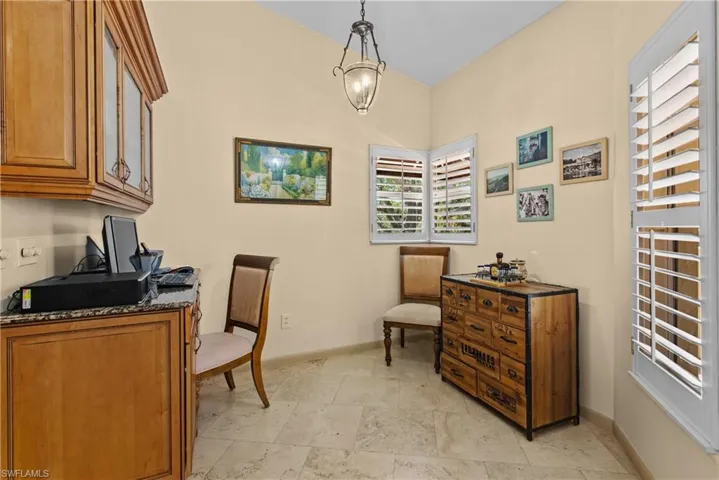 View of built in home office near entry door, just off the kitchen