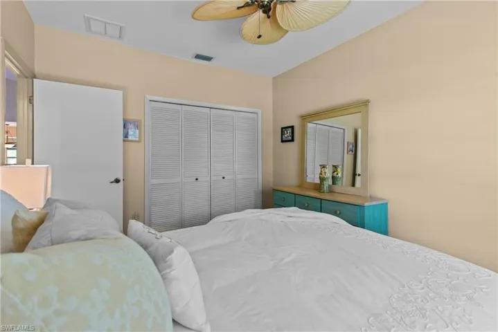 Bedroom 2 with a closet and ceiling fan