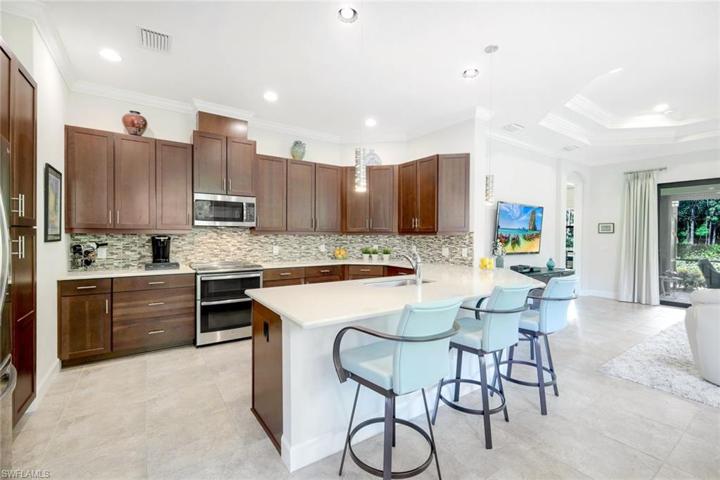 Cabinets galore, double oven and custom backsplash.
