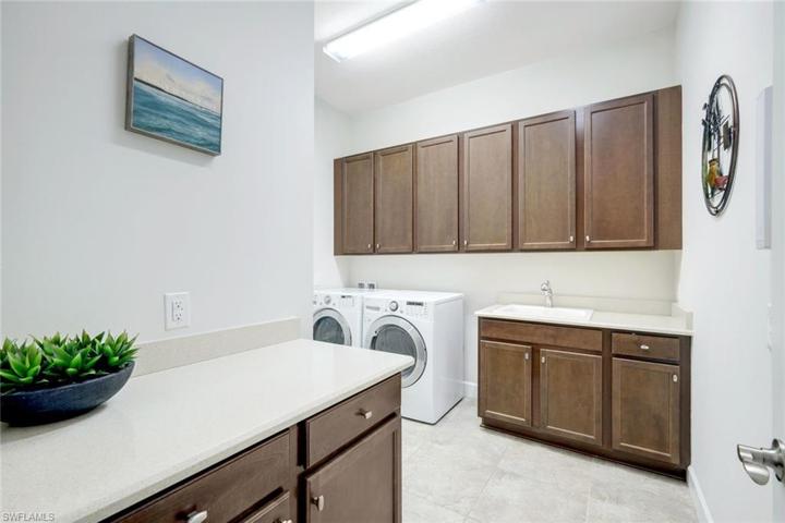 Spacious laundry room with sink and MORE cabinets!