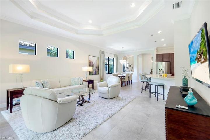 Tile floor throughout the living area with volume ceilings.