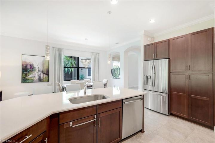 Notice the large pantry alongside the refrigerator.