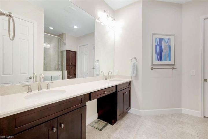 En-suite bath includes walk in shower and dual sinks - this bathroom is spacious enough for TWO!