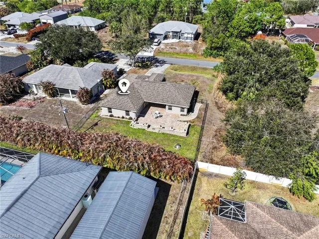 The backyard has large mature palm trees as a natural property barrier, providing the ultimate in privacy!