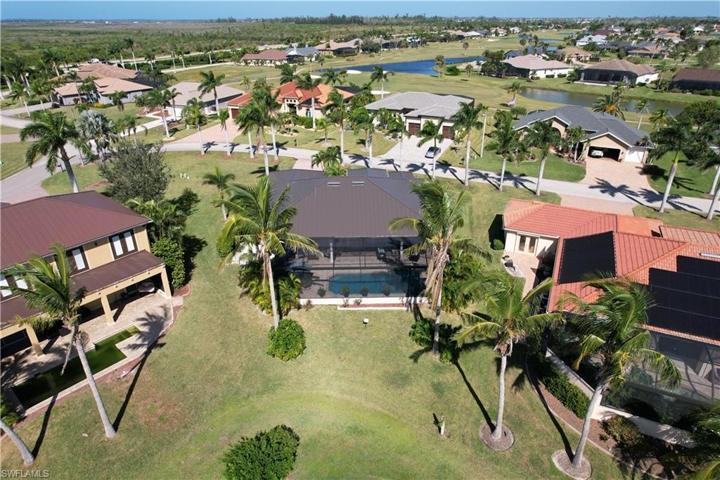 Back of the home with new pool cage