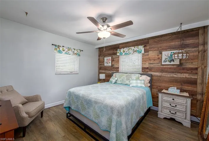 Bedroom featuring a closet, ceiling fan, and hardwood / wood-style flooring