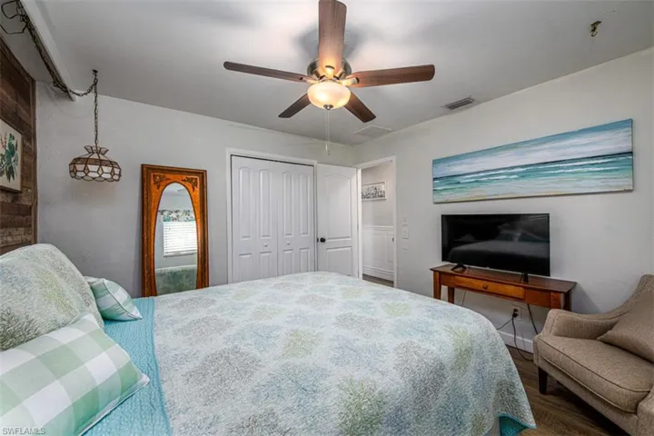 Bedroom featuring a closet, ceiling fan, and hardwood / wood-style flooring