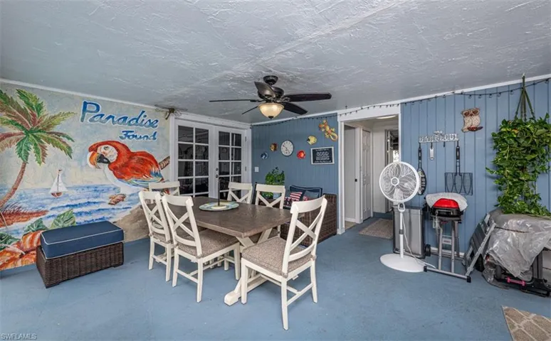 View of patio / terrace featuring french doors and ceiling fan