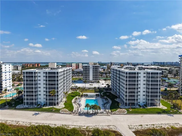 View of urban area with a pool area and apartment complex