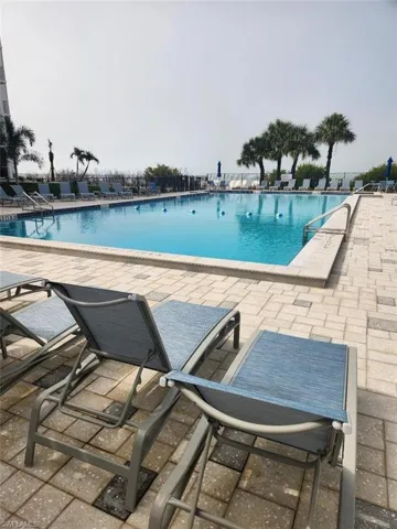 Community pool featuring a patio area