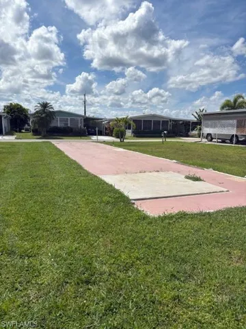 View of community featuring a lawn