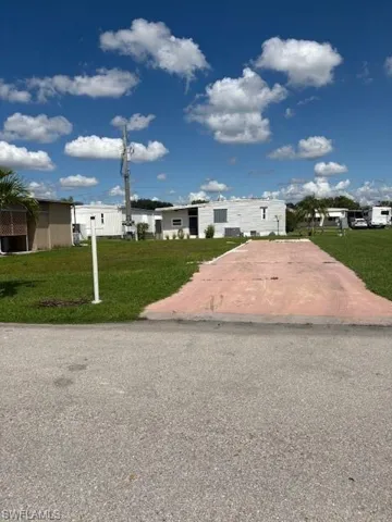 View of front of property with a front lawn