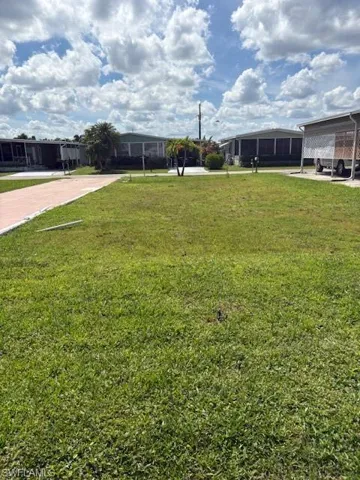 View of yard with a carport