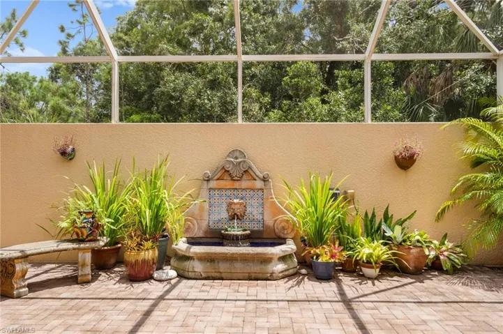 Patio with fountain and sitting areas.