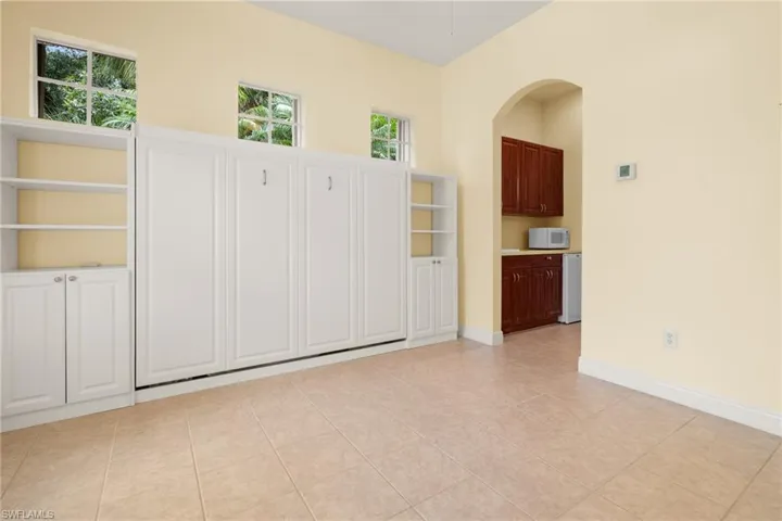 Cabana suite with Queen Murphy Bed, subtle window treatment.