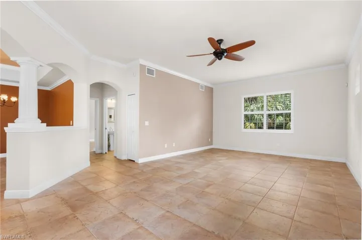 Great Room with architectural details looking into foyer and dining area.