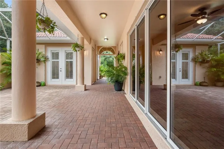 View of enclosed patio looking from front door of Main House outward. Sliding doors from Kitchen area. Cabana suite to left.