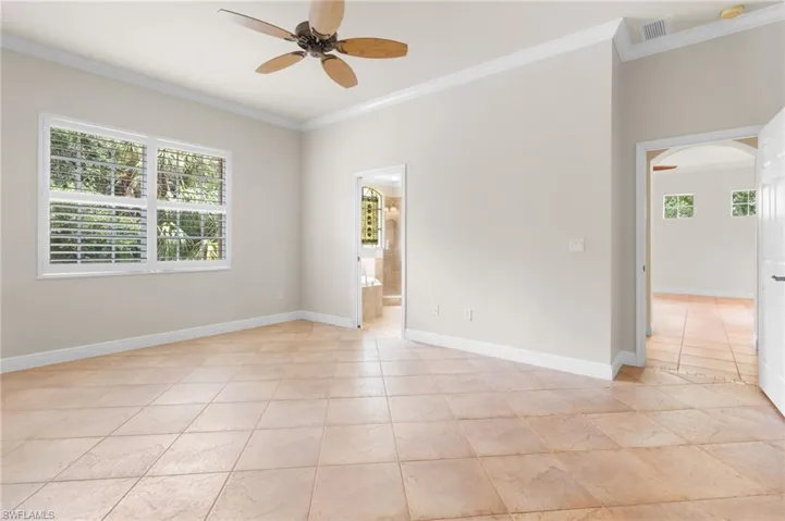 Crown molding, tiled flooring, ensuite bath.