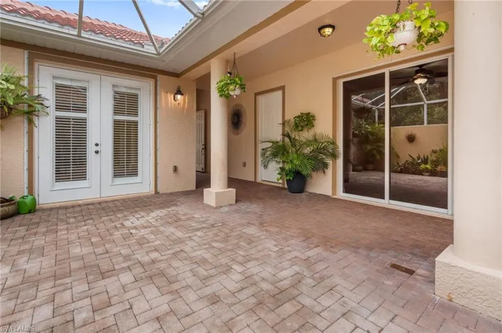 Closeup view of patio with facing Cabana suite and Courtyard entryway.