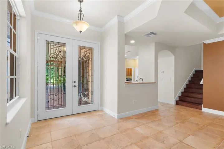 Main house entry foyer. Glass French Doors leading to courtyard.