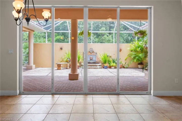 Kitchen area spills outward onto lovely courtyard view.